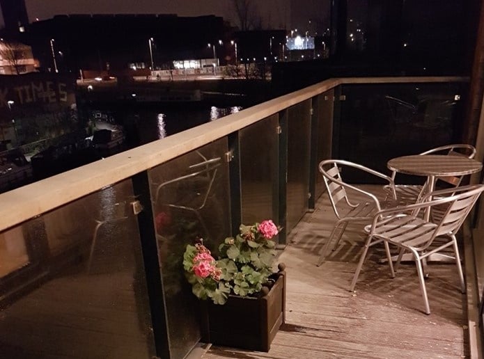 River-facing balcony at night